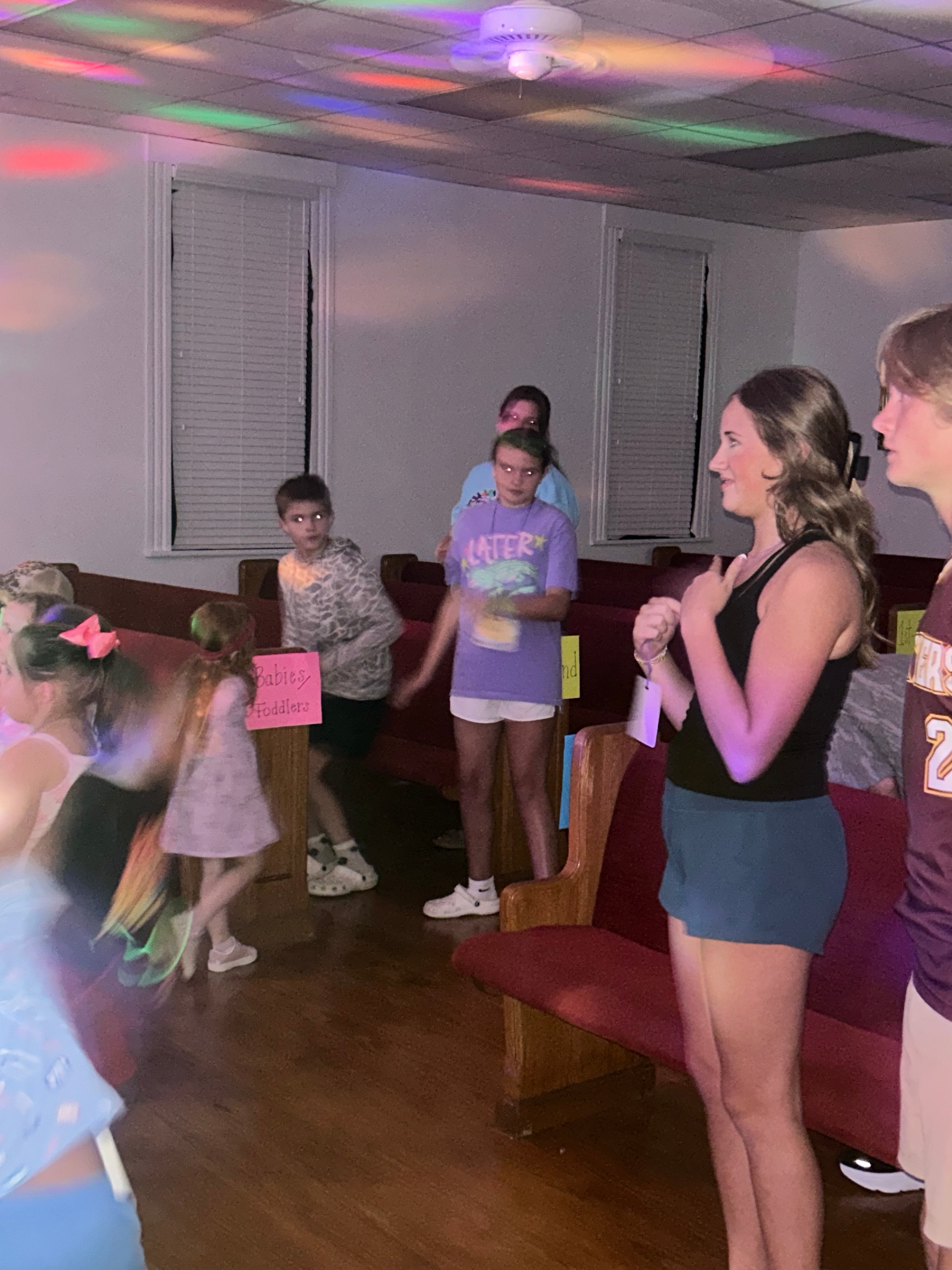 VBS 2026 children and volunteers sharing a joyful moment