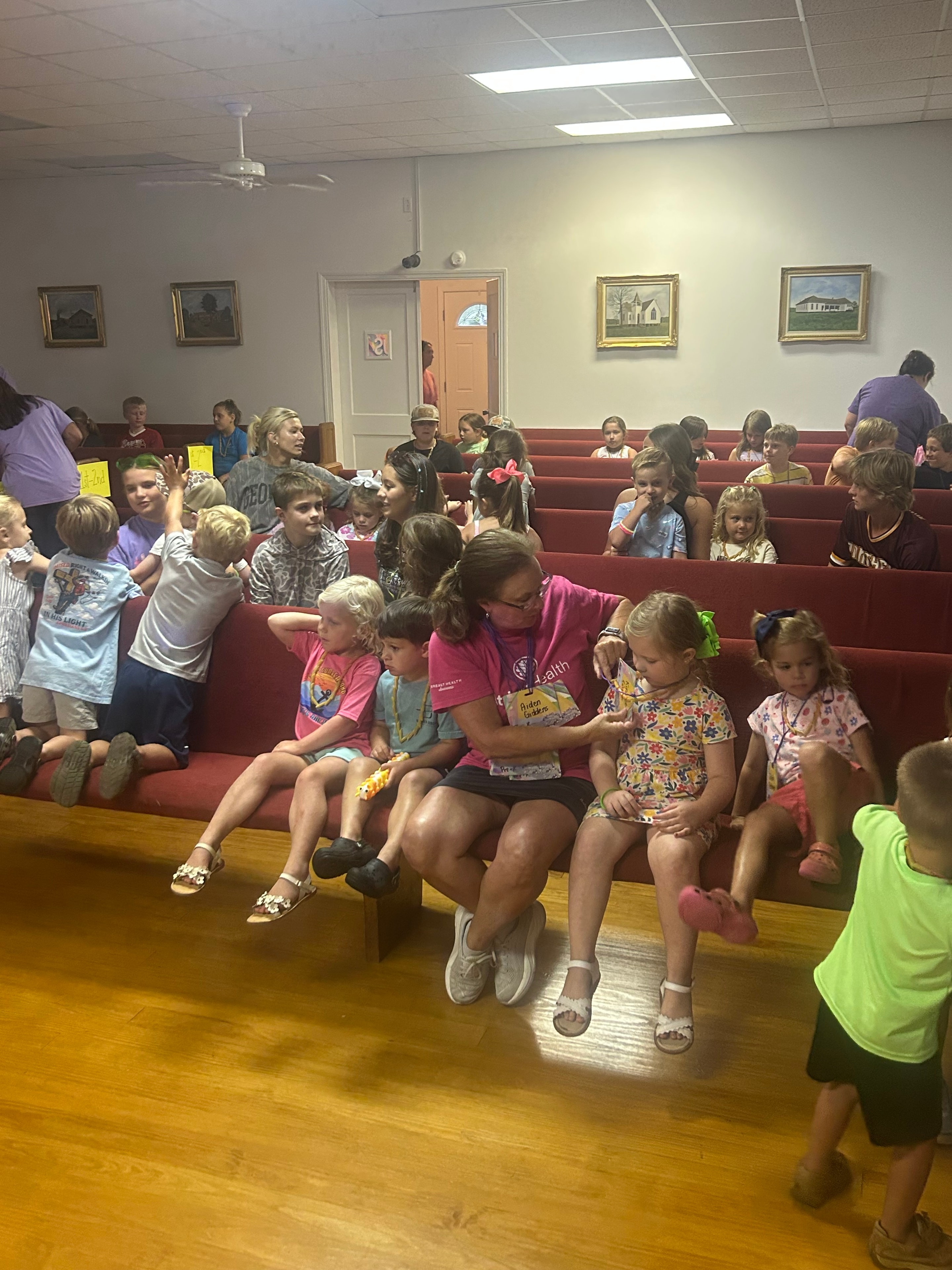 Large group of children gathered in the sanctuary at VBS 2026