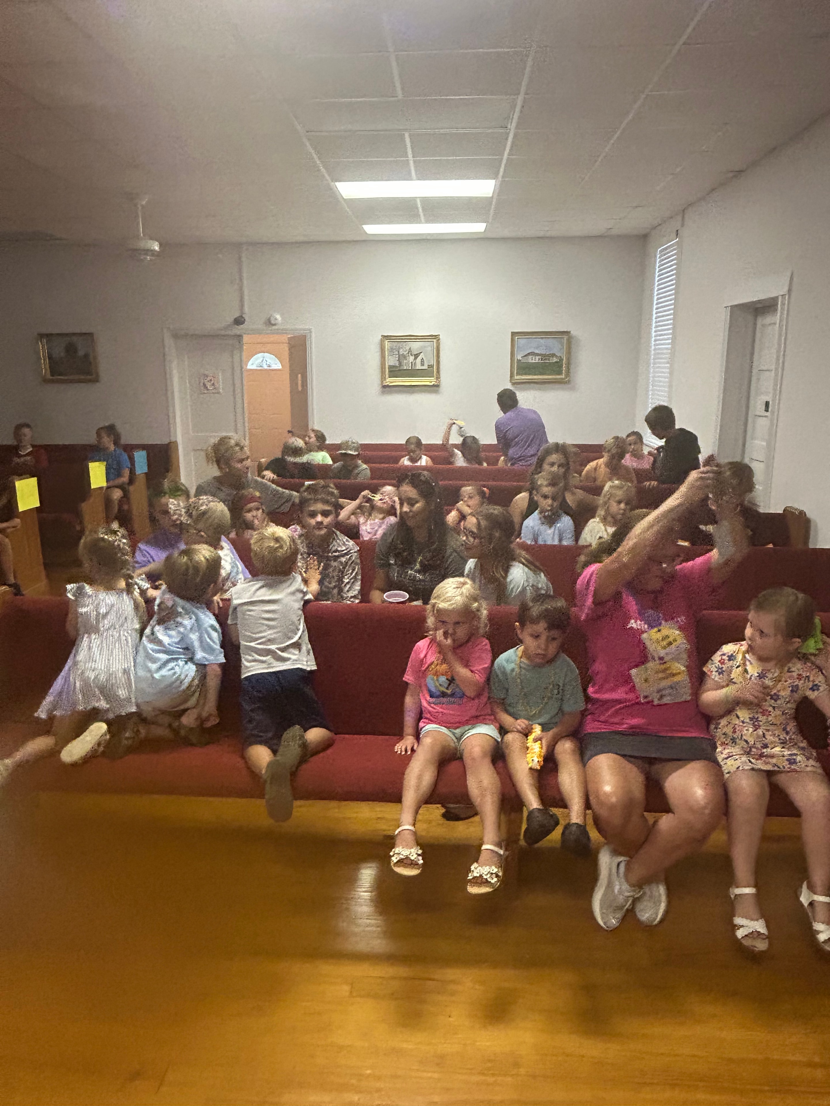 Children and adults gathered in the sanctuary during VBS 2026